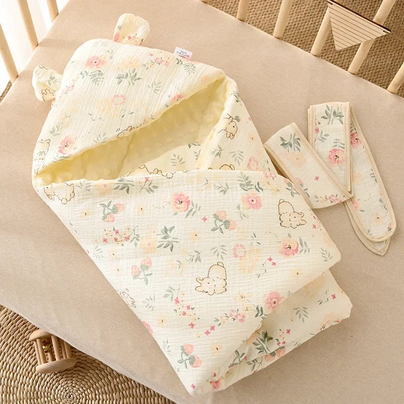 nid d’ange bébé motif floral lapin crème posé sur lit pour nourrisson