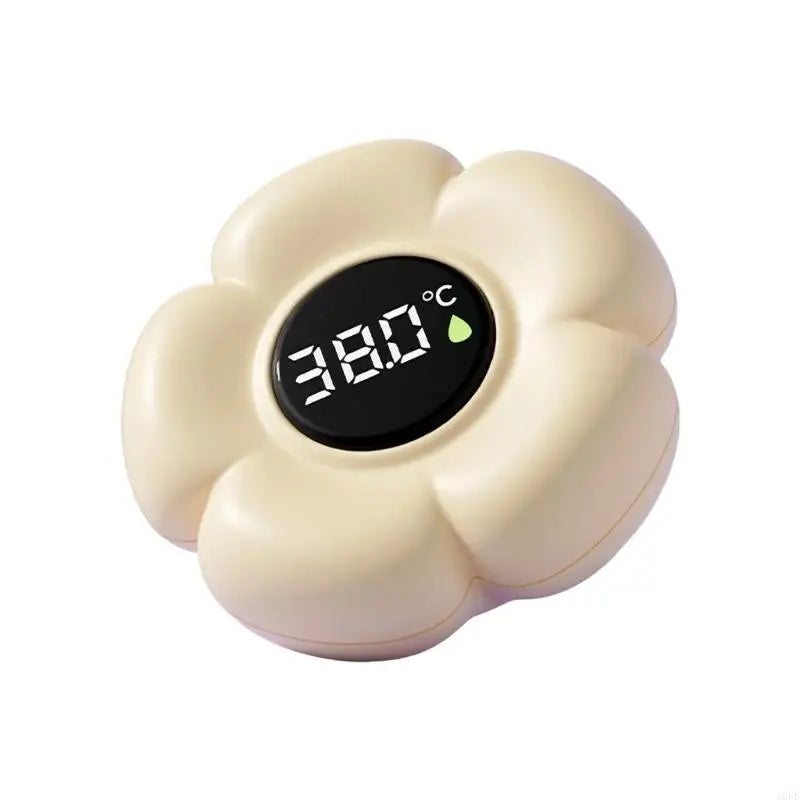 Thermomètre de bain bébé digital crème en forme de fleur avec écran à 38,0°C.